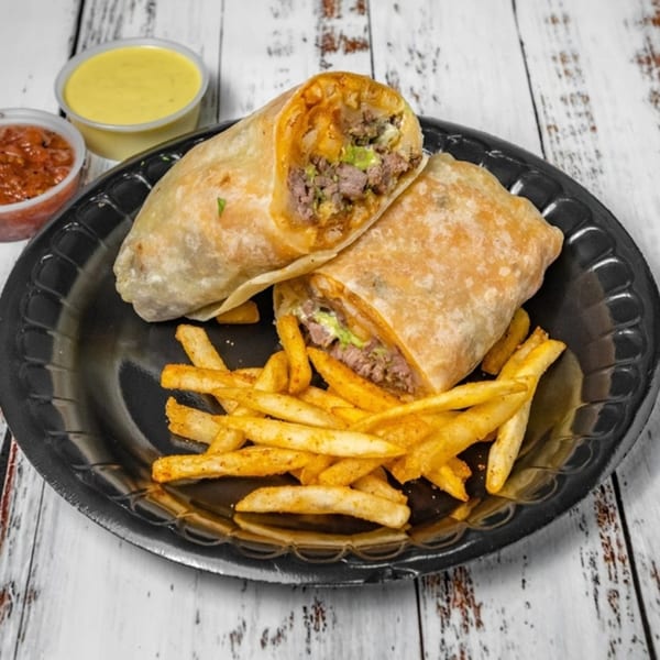 Two Bandeño Mexican Food burritos with fries, salsa, and cheese dip on a black plate.